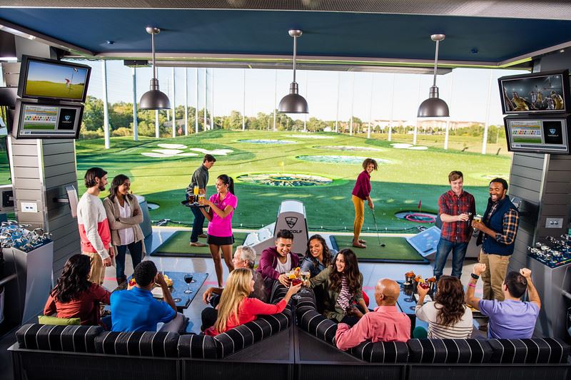 Large group of people having fun at Topgolf