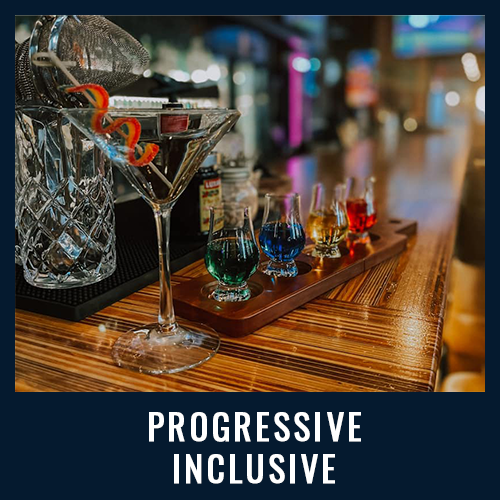 Colorful cocktails and vibrant drink flight on a wooden bar, highlighting a modern setting