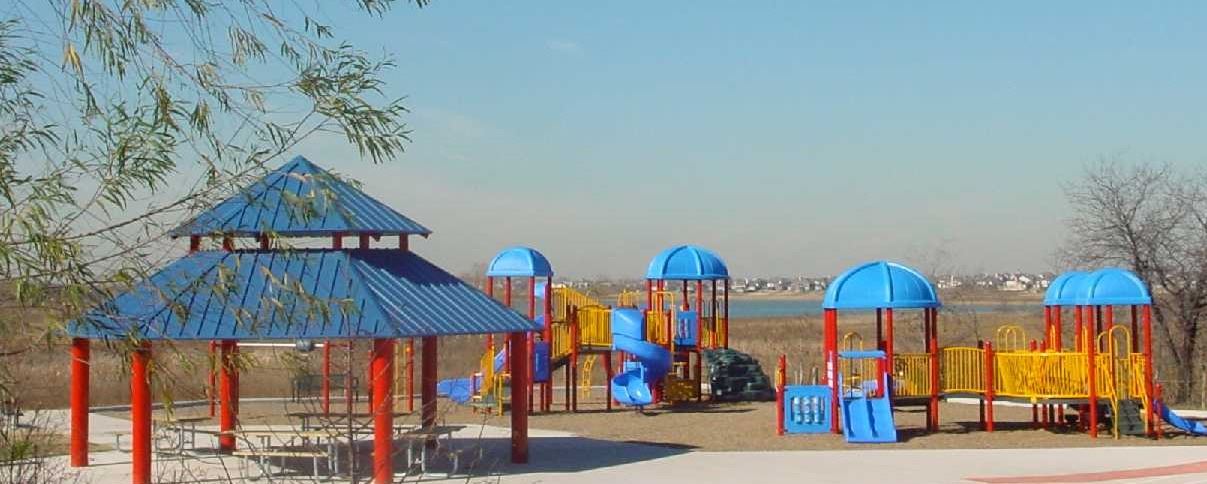 Colorful playground at Ridgepointe Park overlooking Lewisville Lake