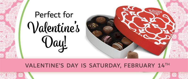 Heart-shaped box of Kilwins chocolates with text promoting Valentine's Day on Saturday, February 
